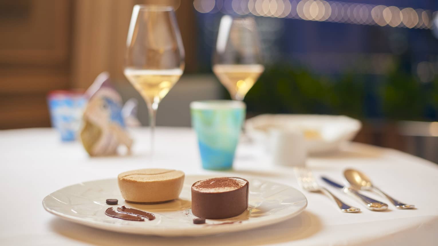 Deconstructed tiramisu on ecru plate set on elegant dining table