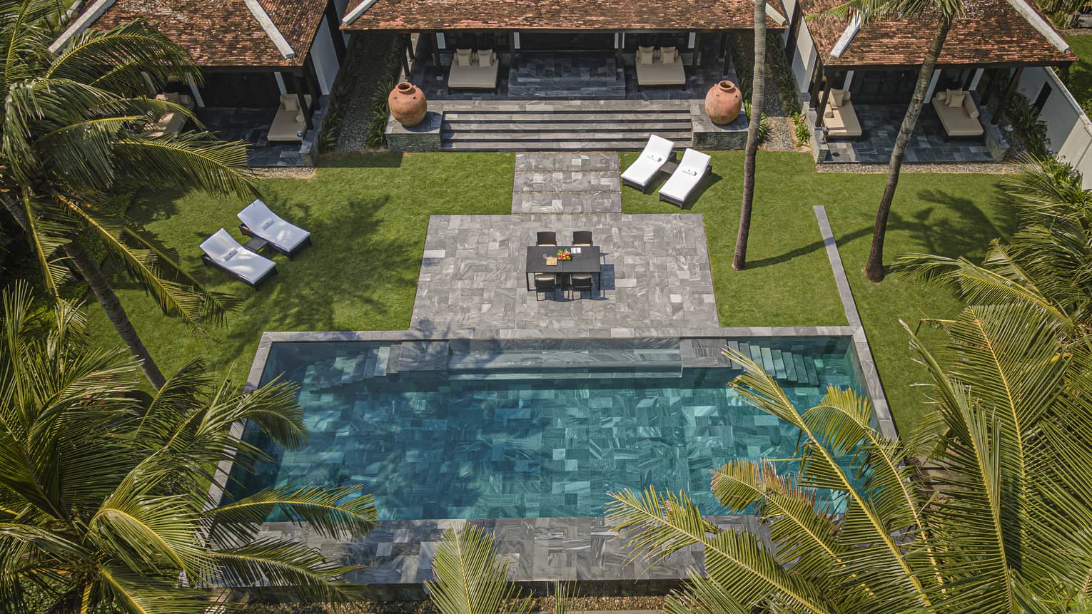 Aerial view of private villa pool and stone terrace