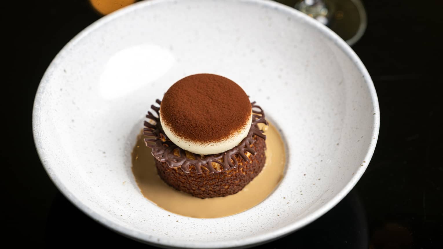 A layered chocolate dessert in a bowl