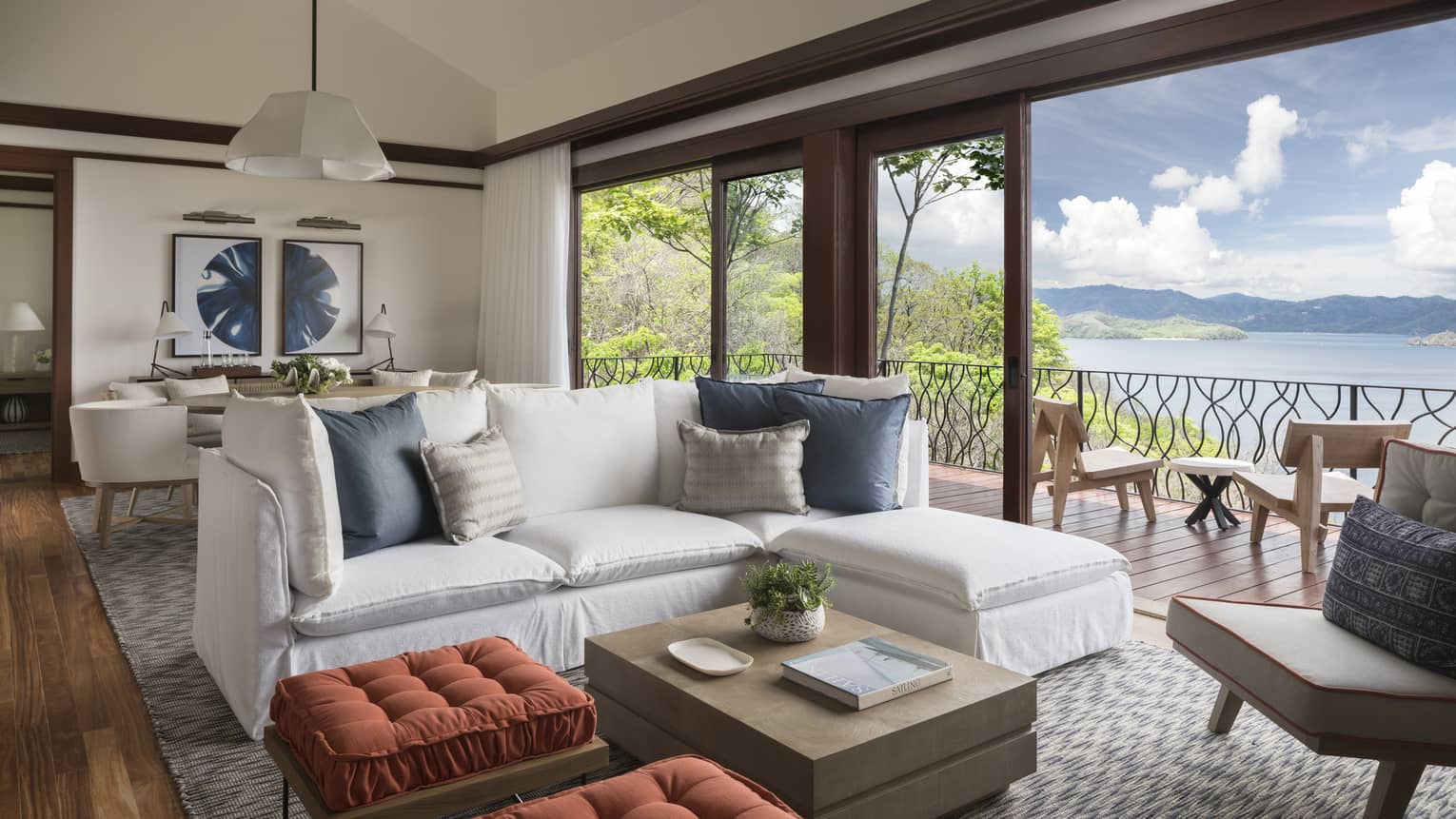 Three-Bedroom Residence Villa with Plunge Pool living room with white L-shaped sofa, ottomans by open patio door