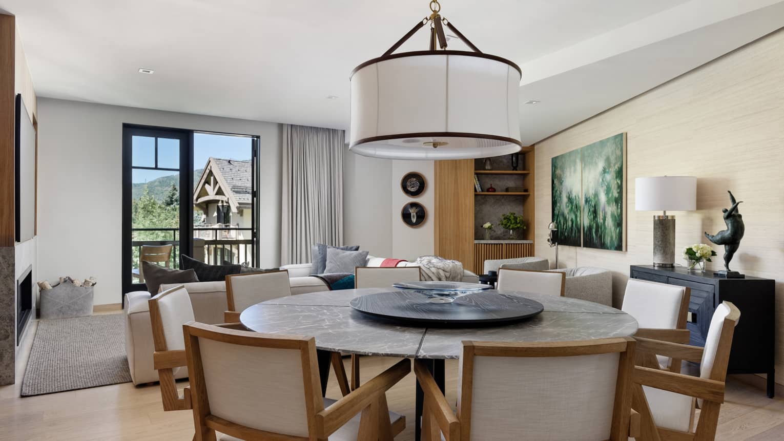 Dining room with round table and 8 chairs in a three-bedroom residence at Four Seasons Vail