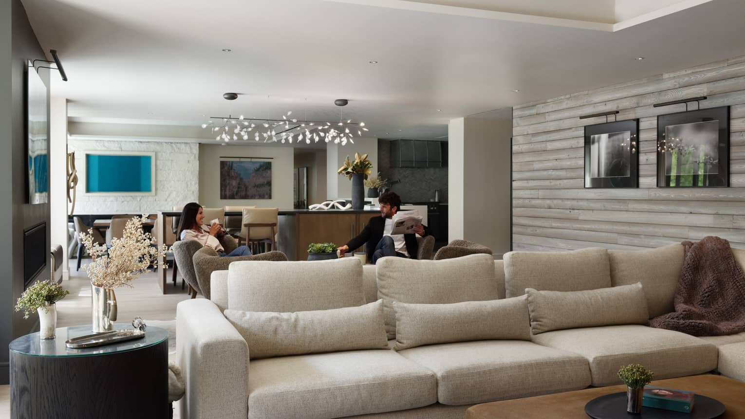 Stylish private residence living room with sofa leading into dining area, Lover's Leap at Four Seasons Resort and Residences Vail