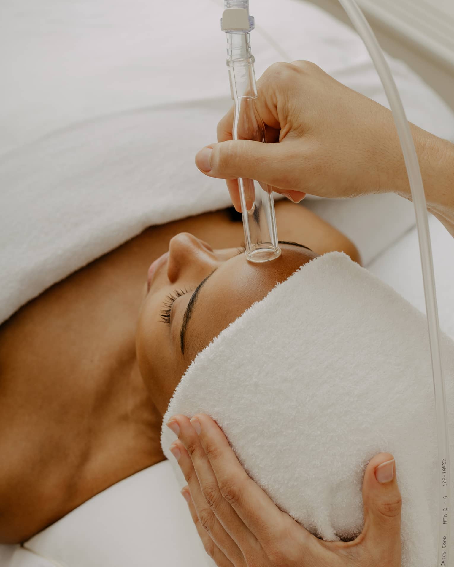 Woman gets a HydraFacial at spa