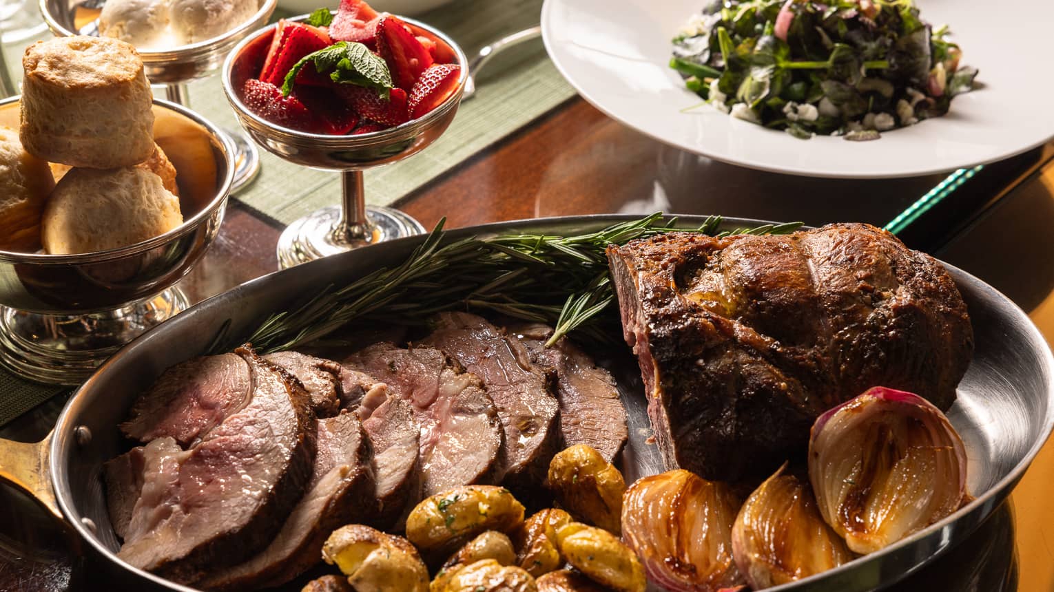 Plates with food including roasted meat