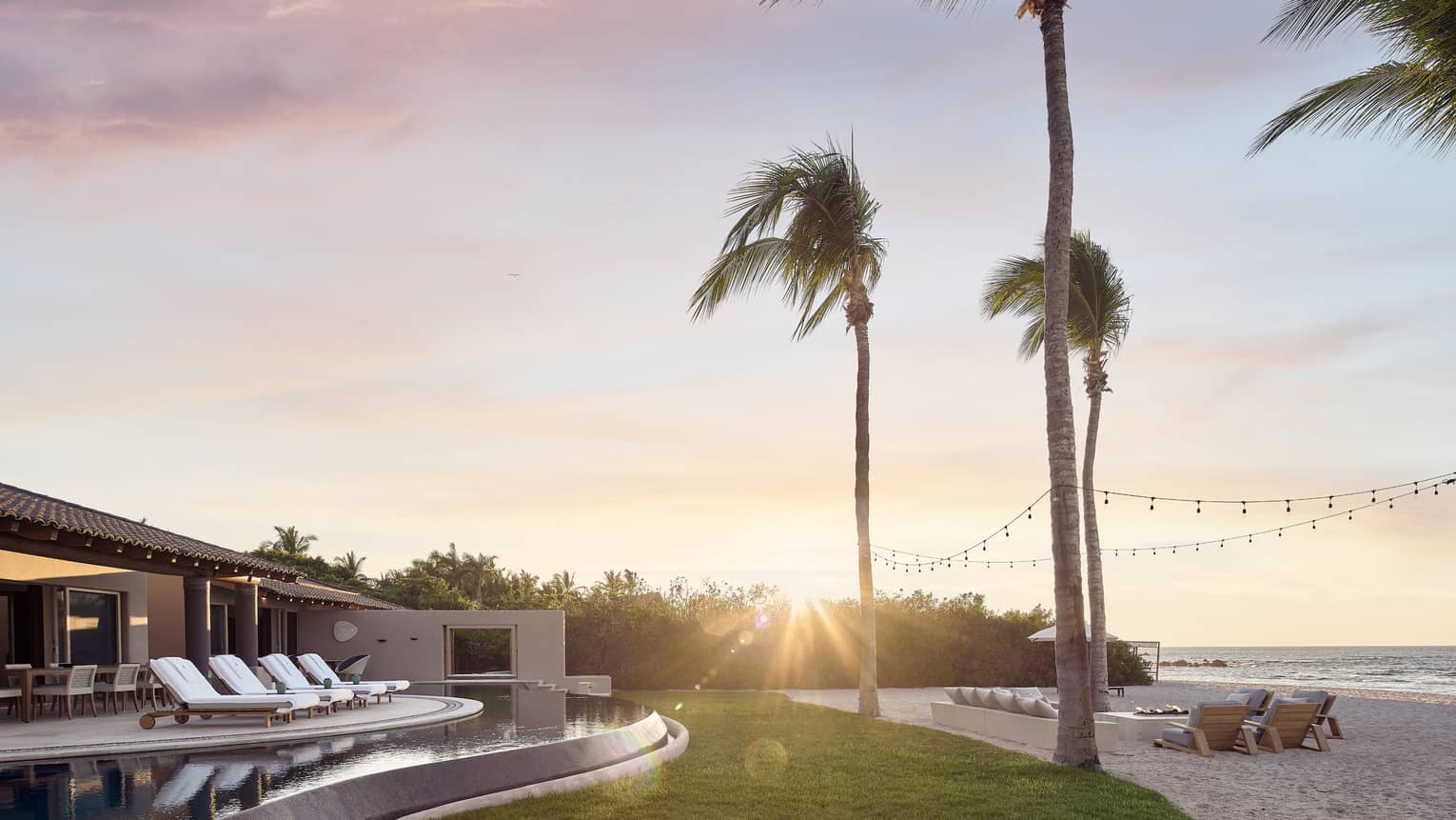 Coral Beach House exterior at sunset