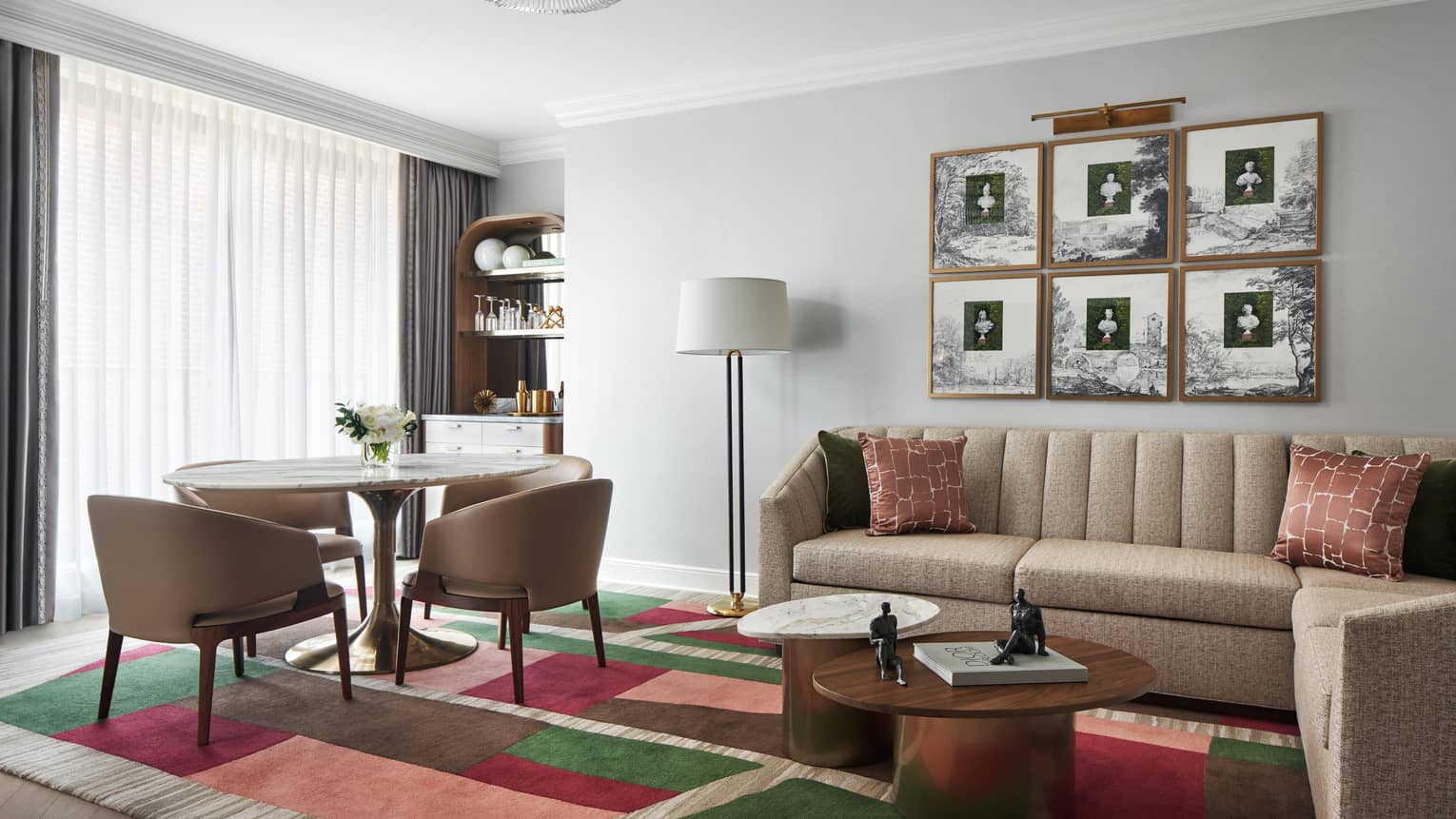 Capital Suite living room with sofa and round dining table with four chairs, at Four Seasons Hotel Washington, DC