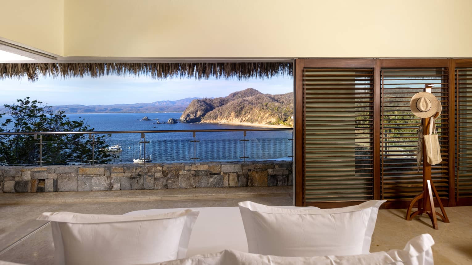 Living room with wall of shuttered doors opening to Tamarindo Beach view ? Casa Piedra, Four Seasons Resort Tamarindo, Mexico