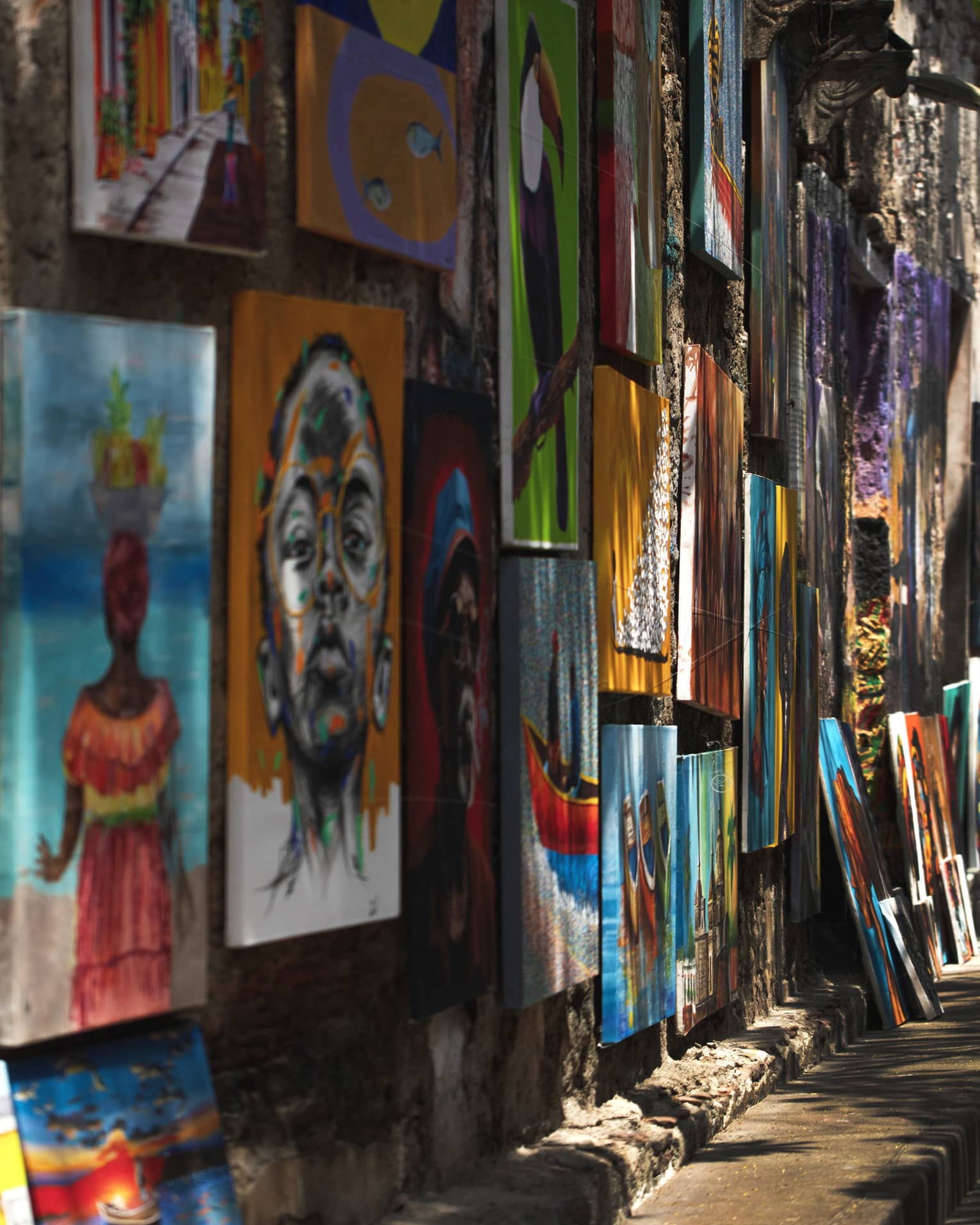 City street with colourful artwork on a wall