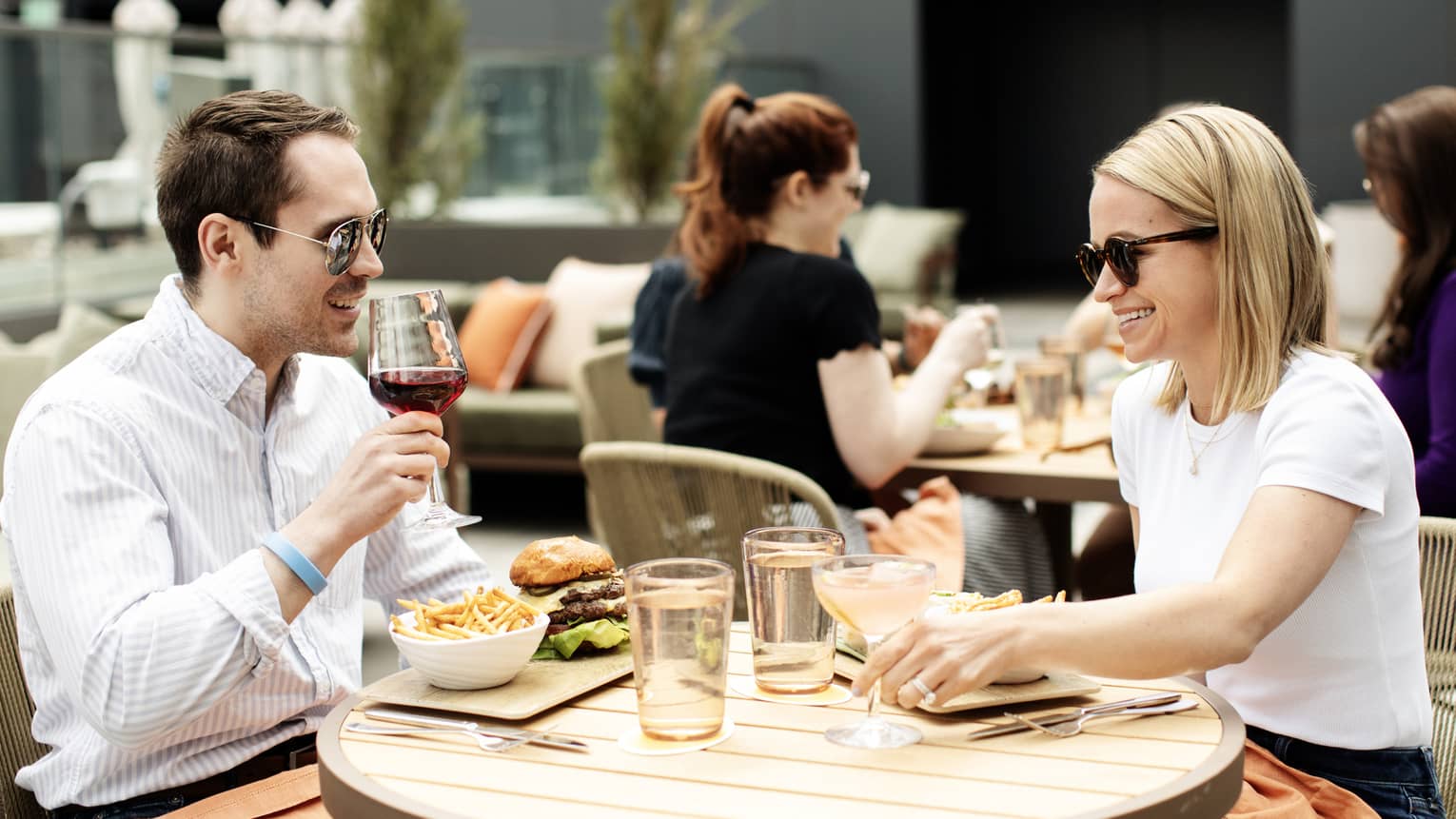 Guests enjoy cocktails on a terrace