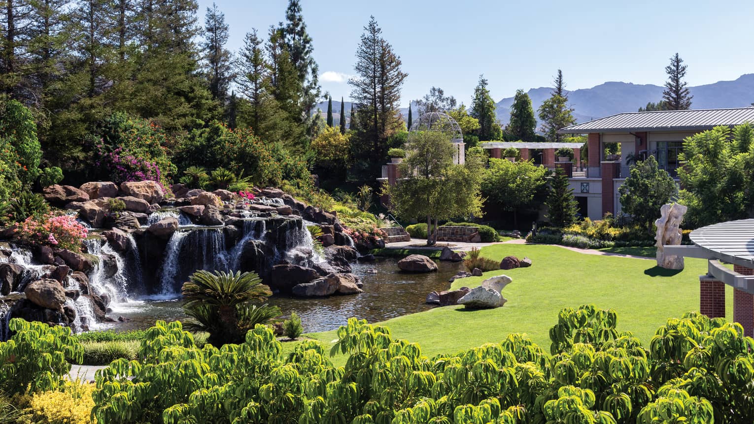 Waterfalls over rocks, boulders in garden at Four Seasons Hotel Westlake Village