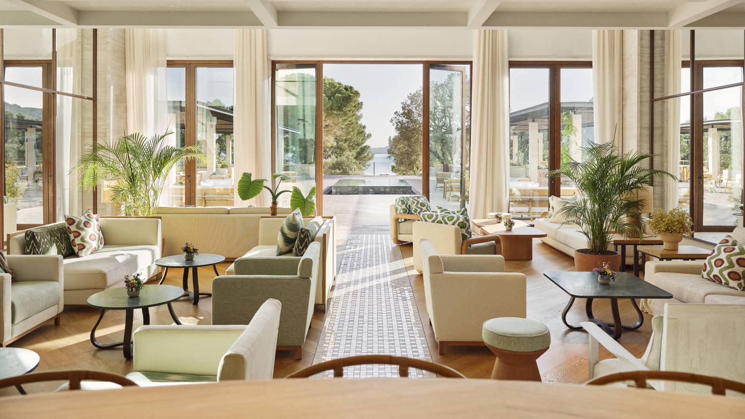 A chic lounge at luxury hotel, leading to outdoor terrace