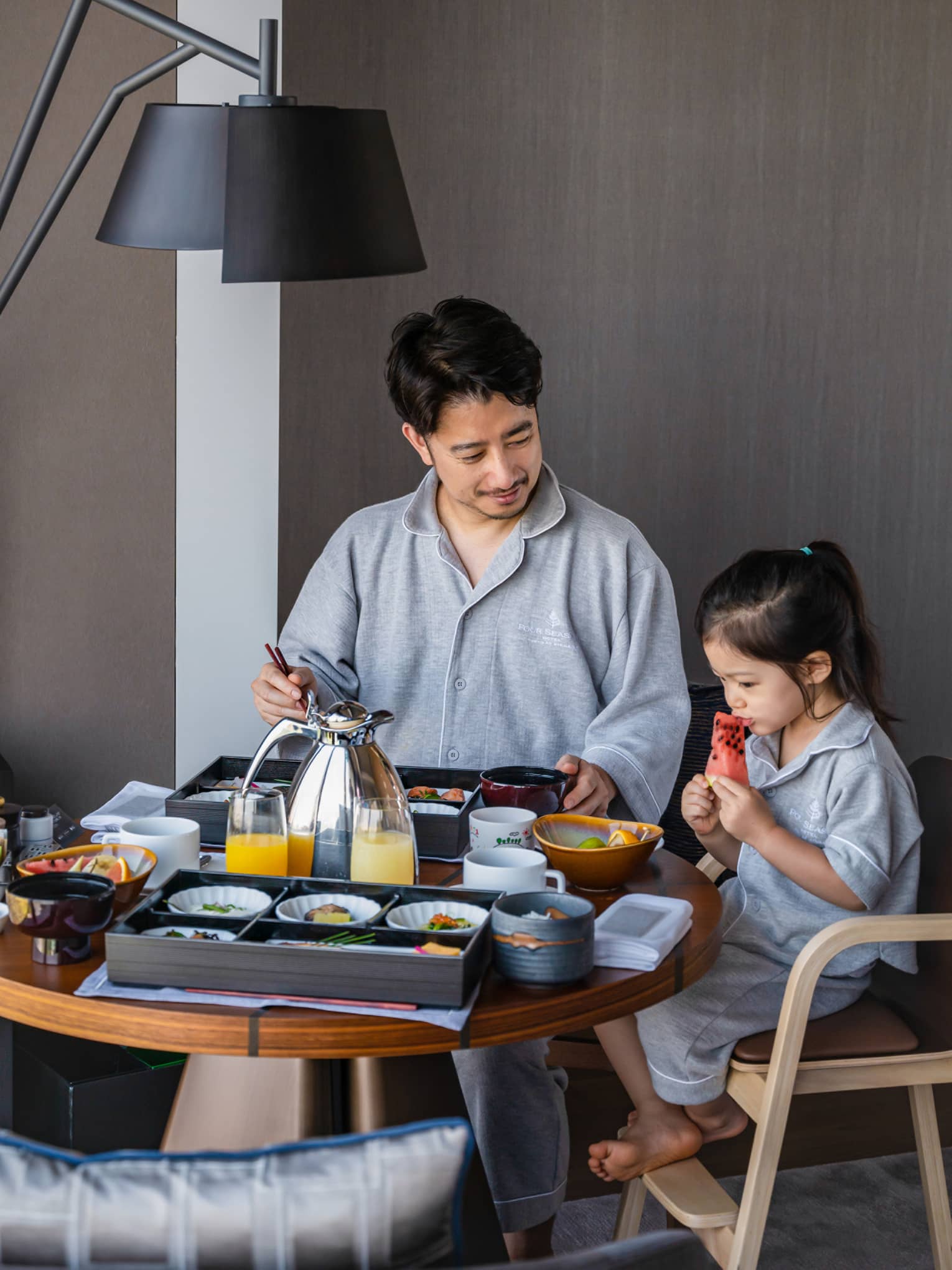 Man and his daughter enjoy In-Room Dining breakfast