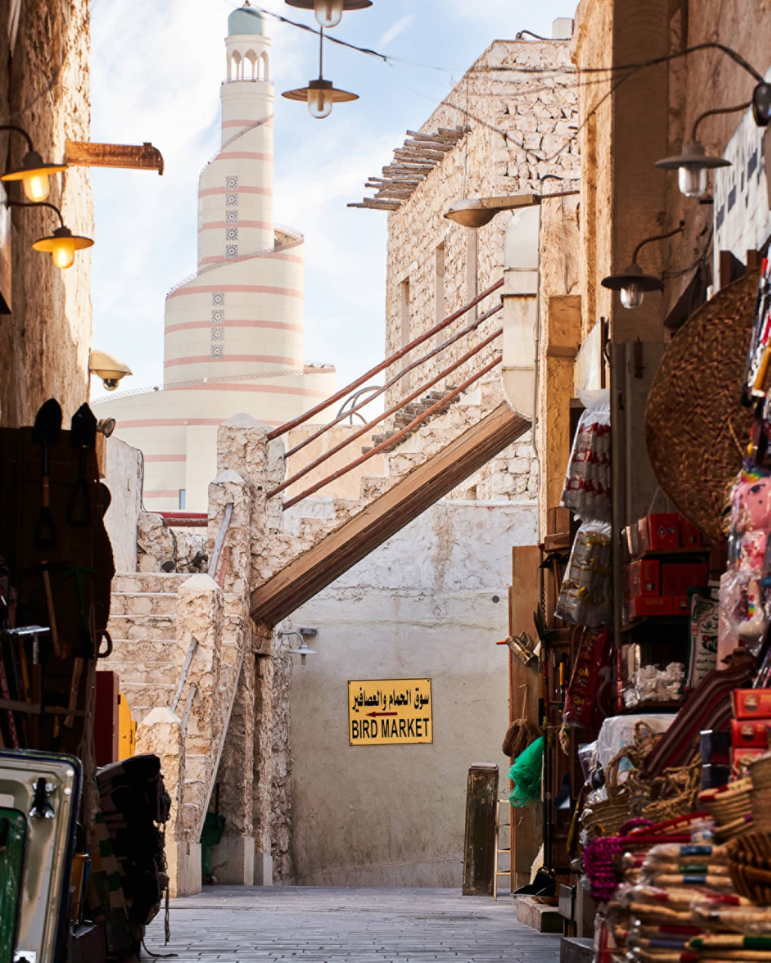 Market place alley way opens up to a tall spiral building
