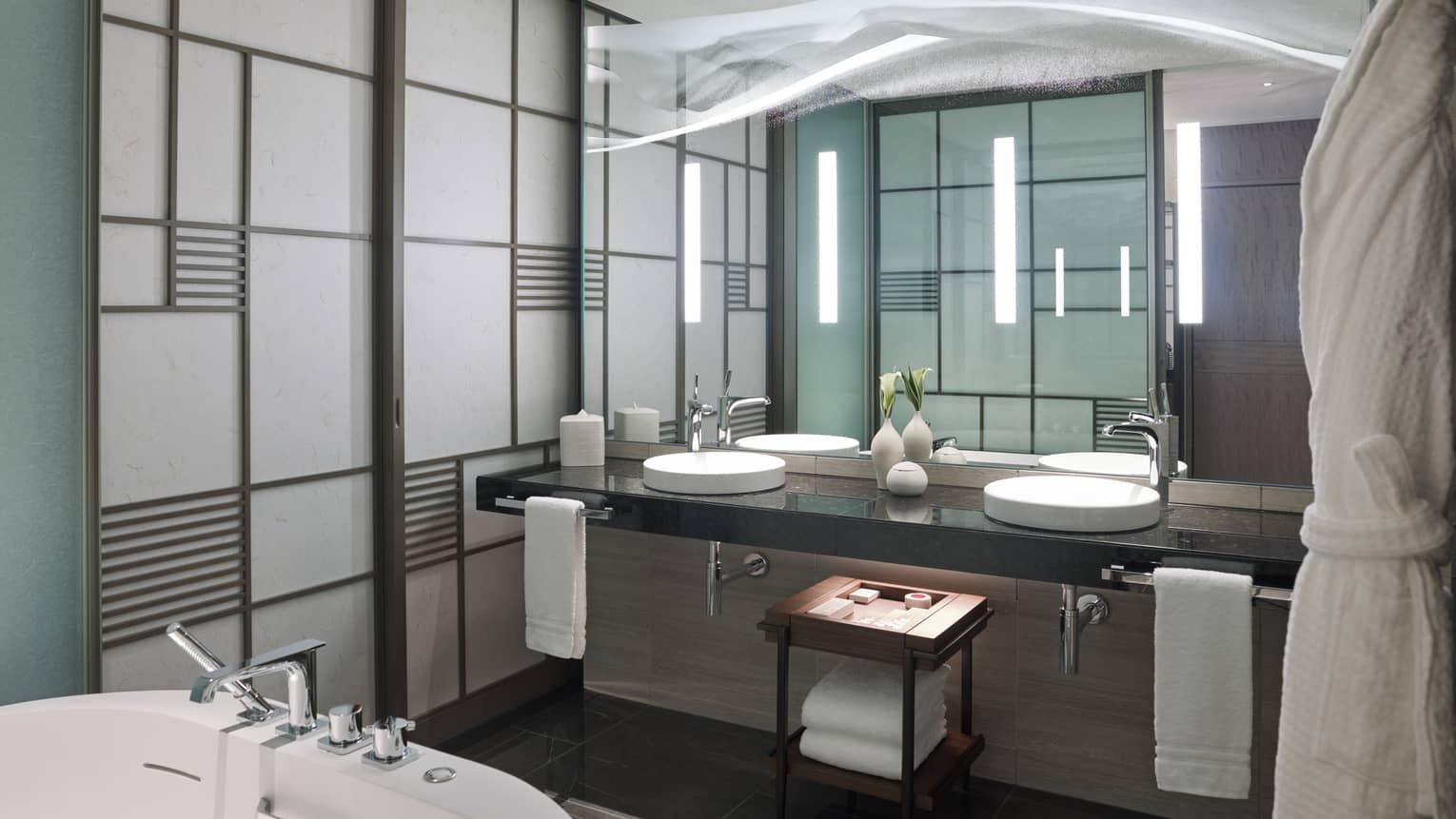 Modern bathroom with a double-sink vanity, large mirror and sleek accent lighting, featuring light-coloured panelled walls