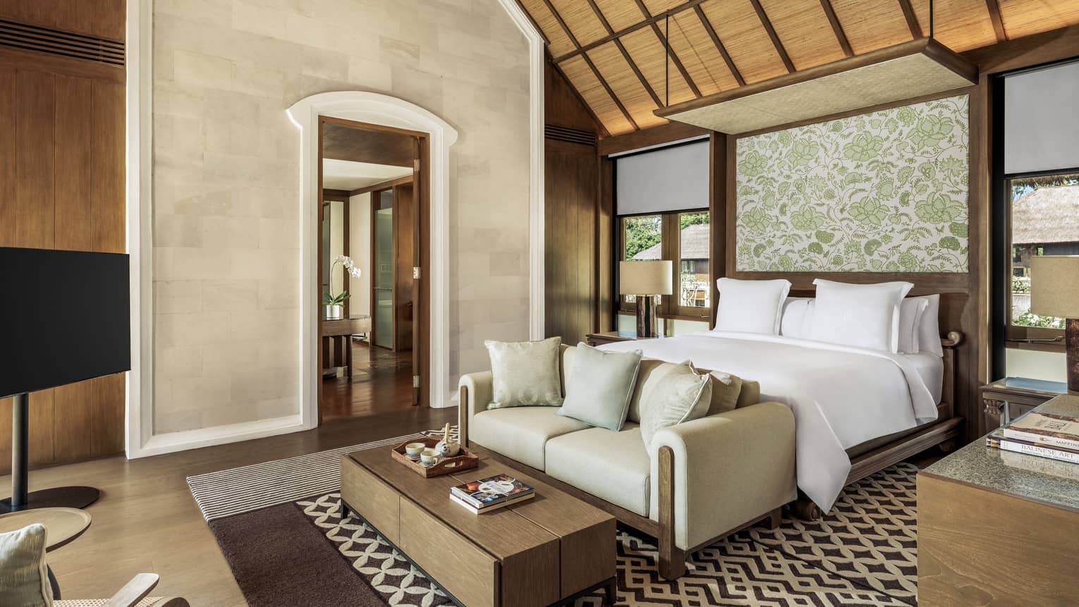 Luxury bedroom with king bed and vaulted ceiling in a private residence at at Four Seasons Resort Bali at Jimbaran Bay