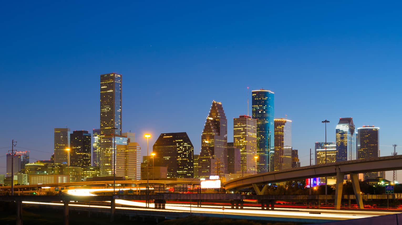 Houston city skyline, highway at night