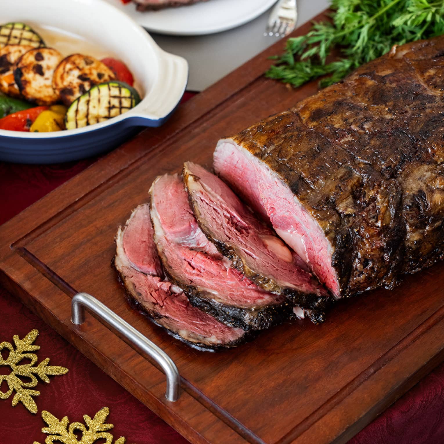 Festive Christmas roasted beef, sliced on a wooden cutting board
