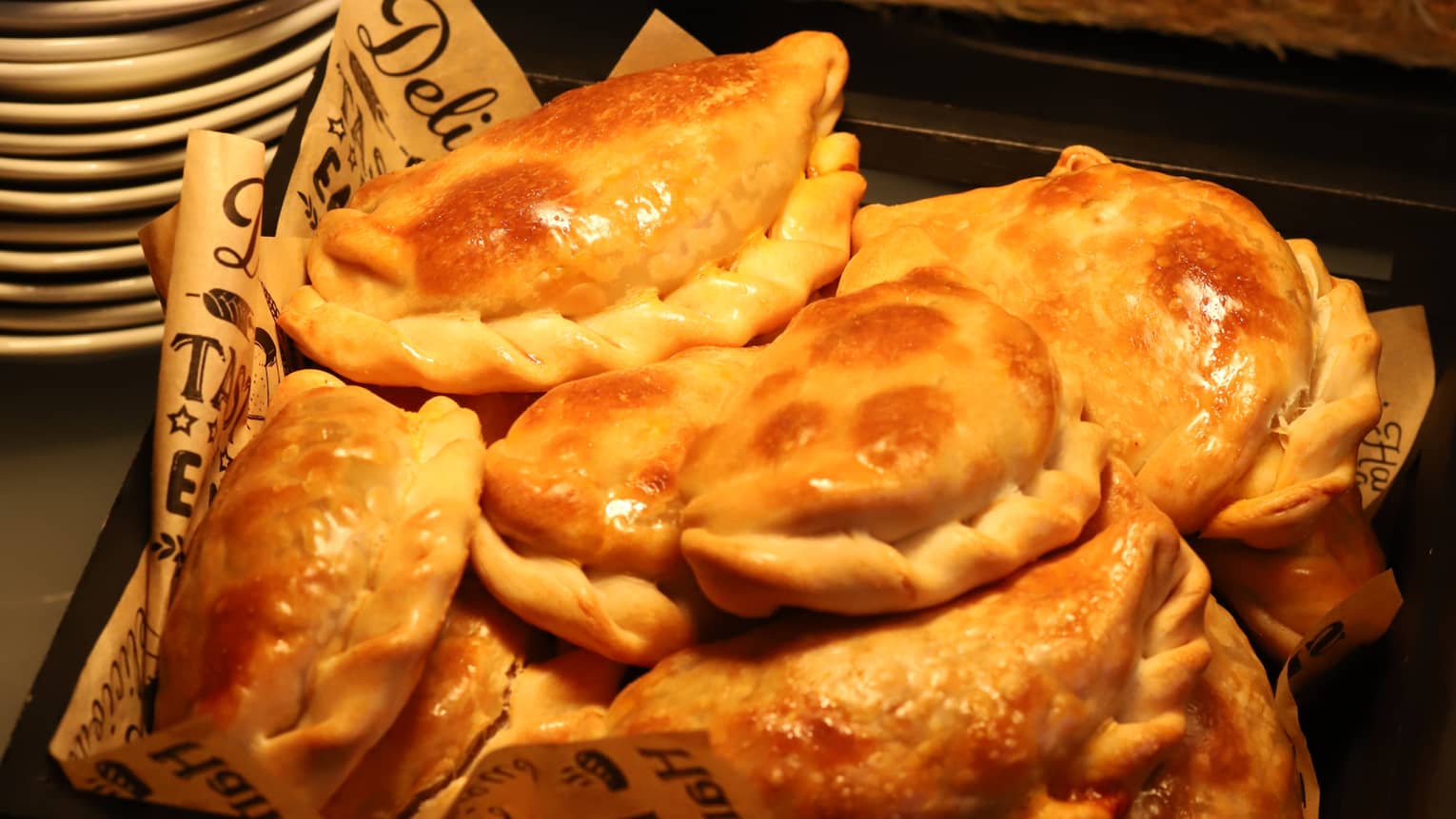 Empanadas served in a square black platter