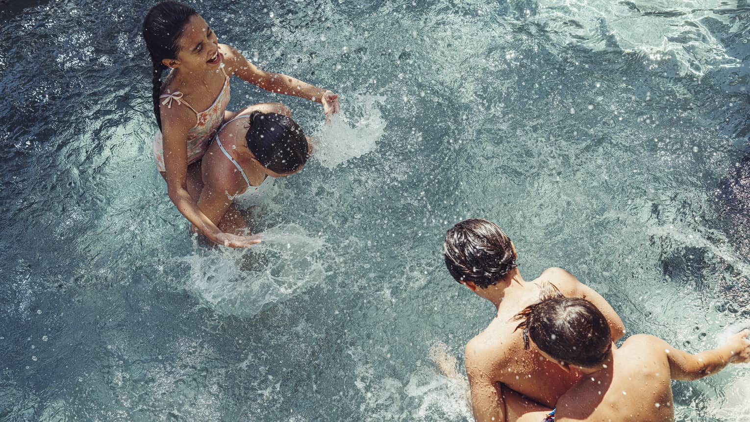 Family splashing in the pool