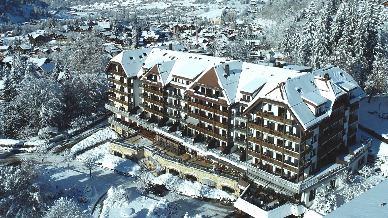 Aerial rendering of resort with mountains in background