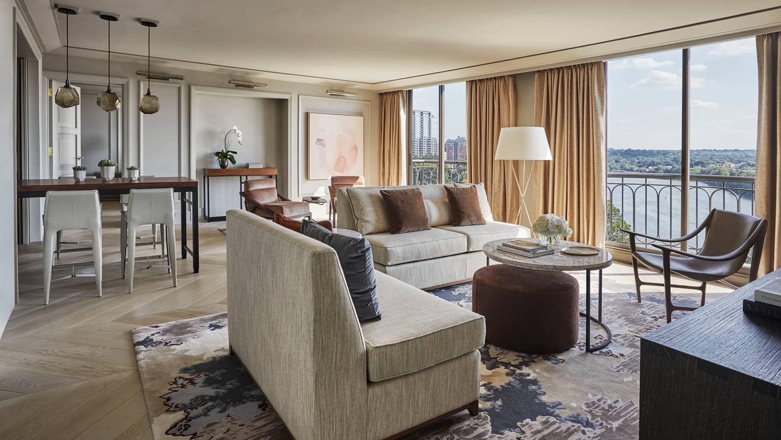 Hotel room dining stools, seating area by room-length floor-to-ceiling windows