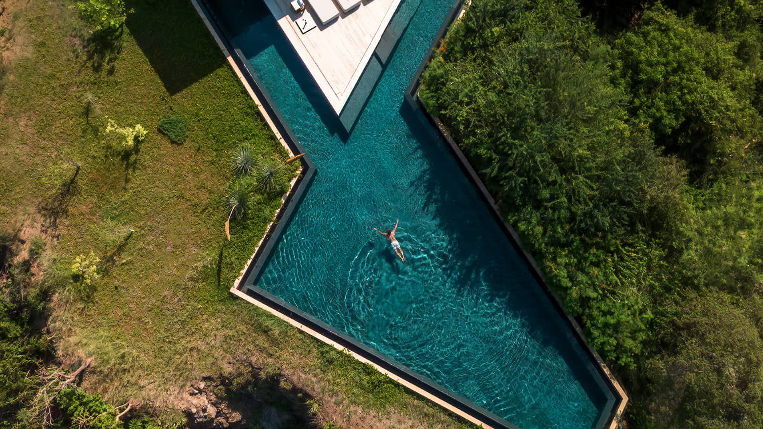 Aerial view of geometric pool of private villa