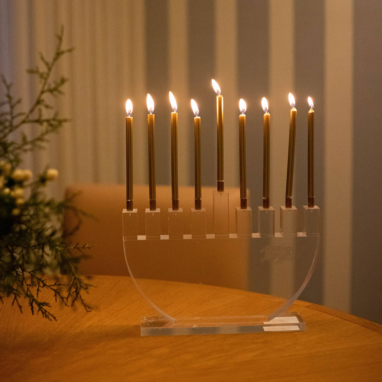A menorah on a wood table.