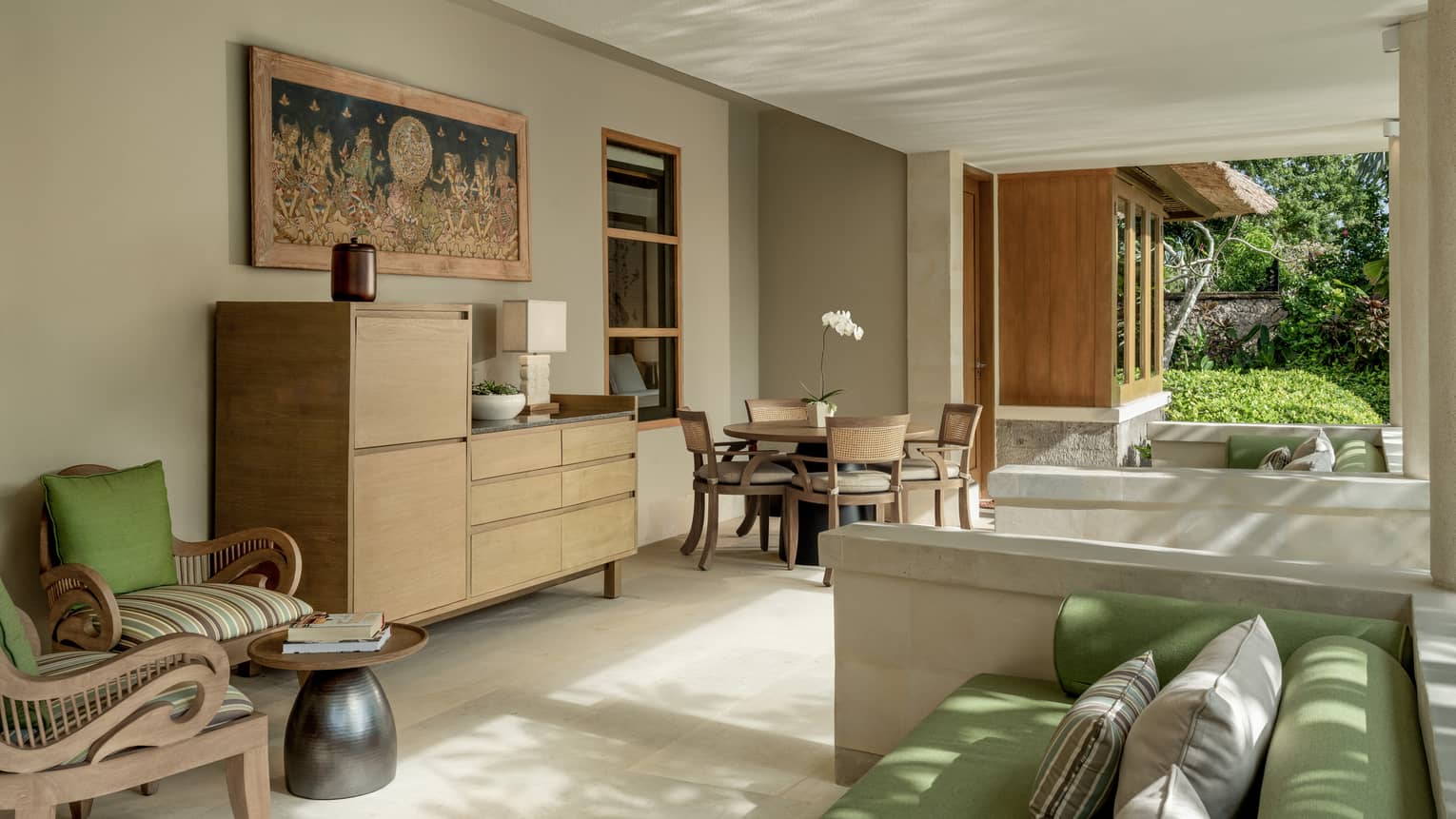 Living area with dining table for four in private residence at at Four Seasons Resort Bali at Jimbaran Bay