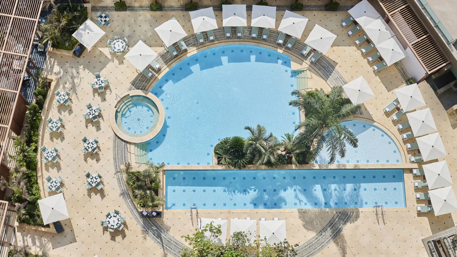 Aerial view of the outdoor pools surrounded by lounge chairs