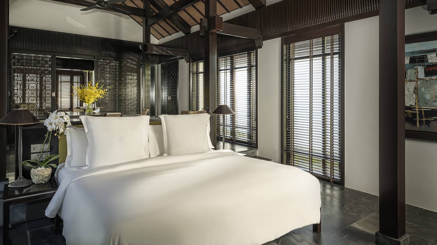 King bed in a private villa with vaulted ceiling