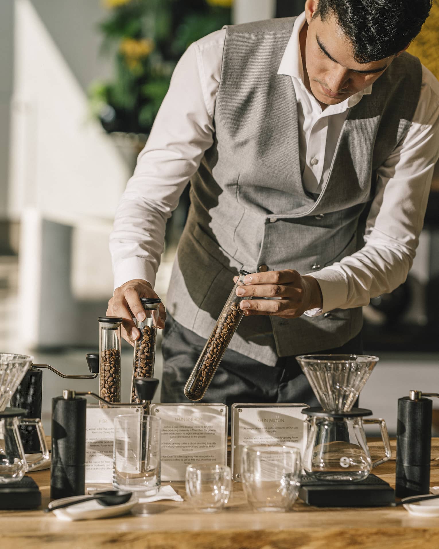 Craftsperson prepares Thai drip coffee