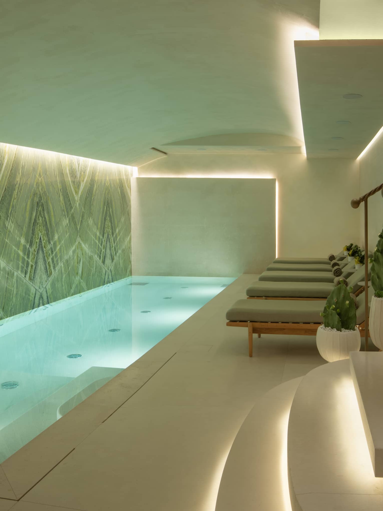 Spa pool area with lounge chairs