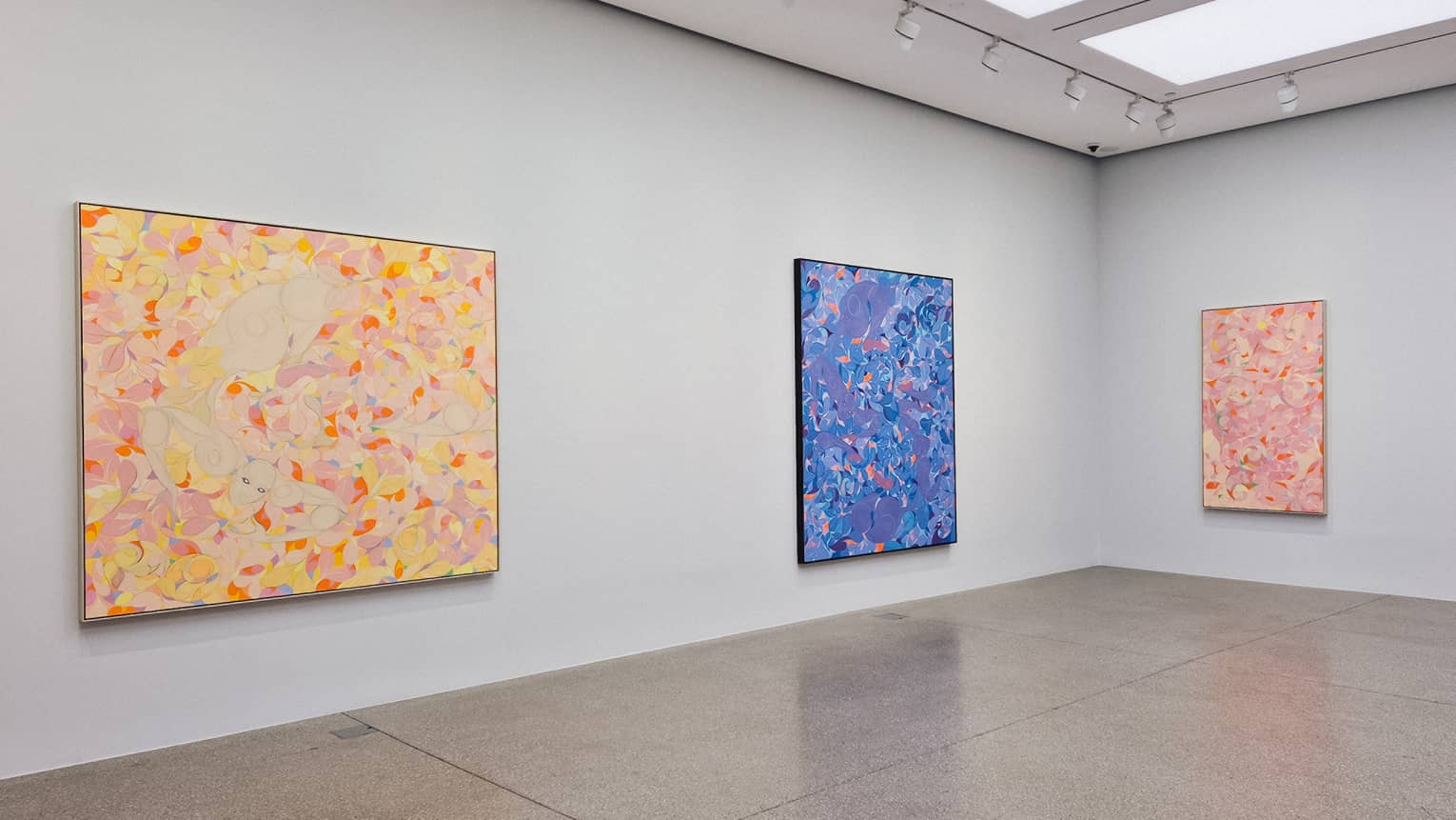 Colourful paintings in an art gallery room