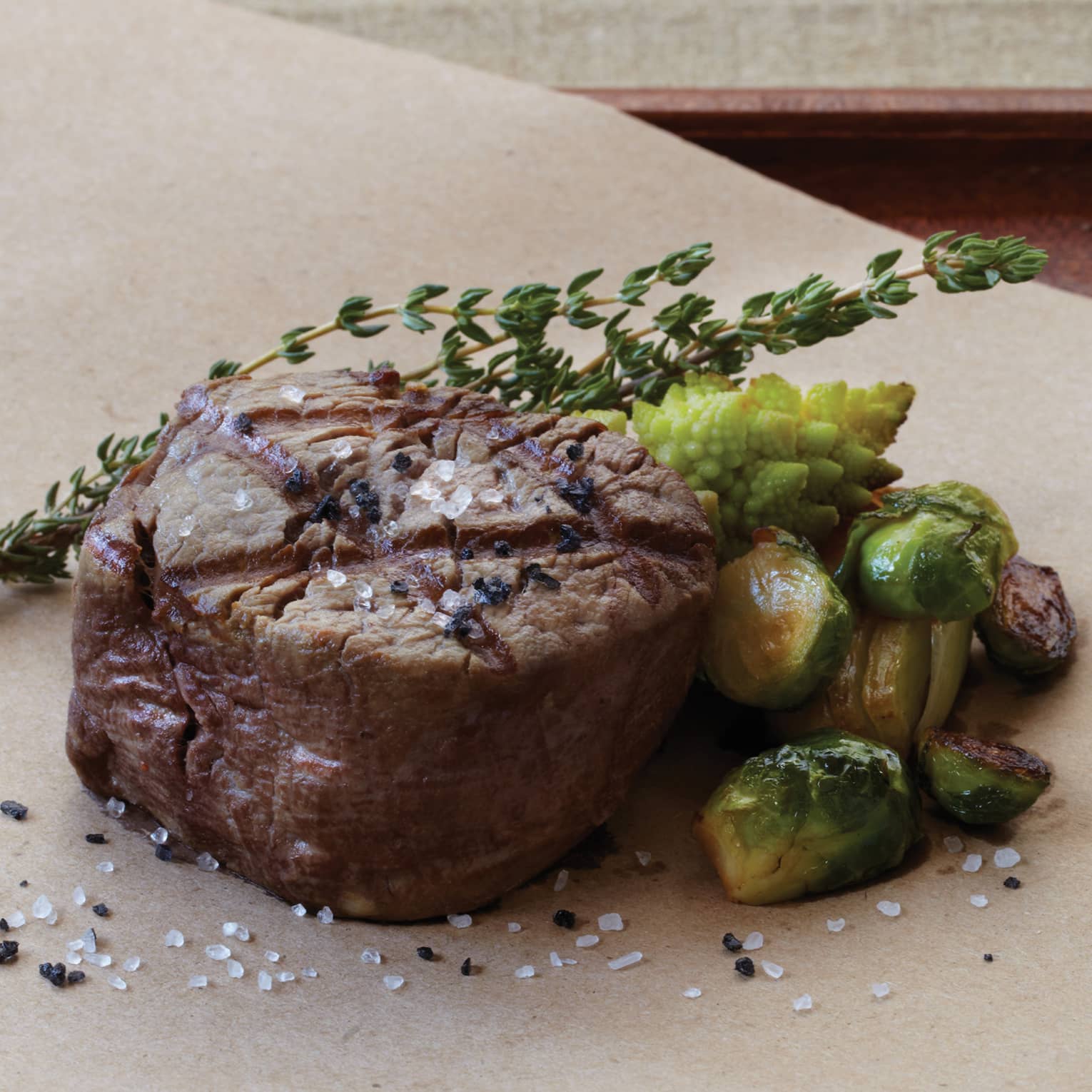 A large steak on a table.