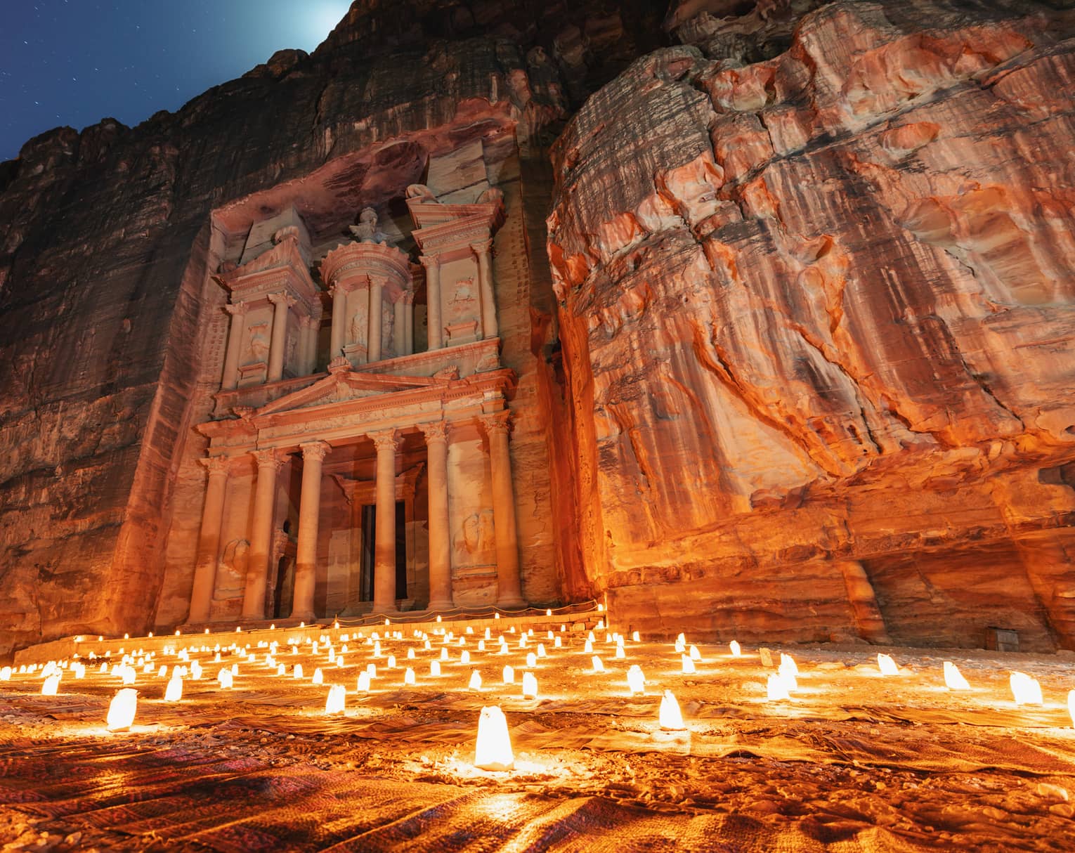 Lantern lit at night at treasury ancient architecture in canyon, Petra in Jordan