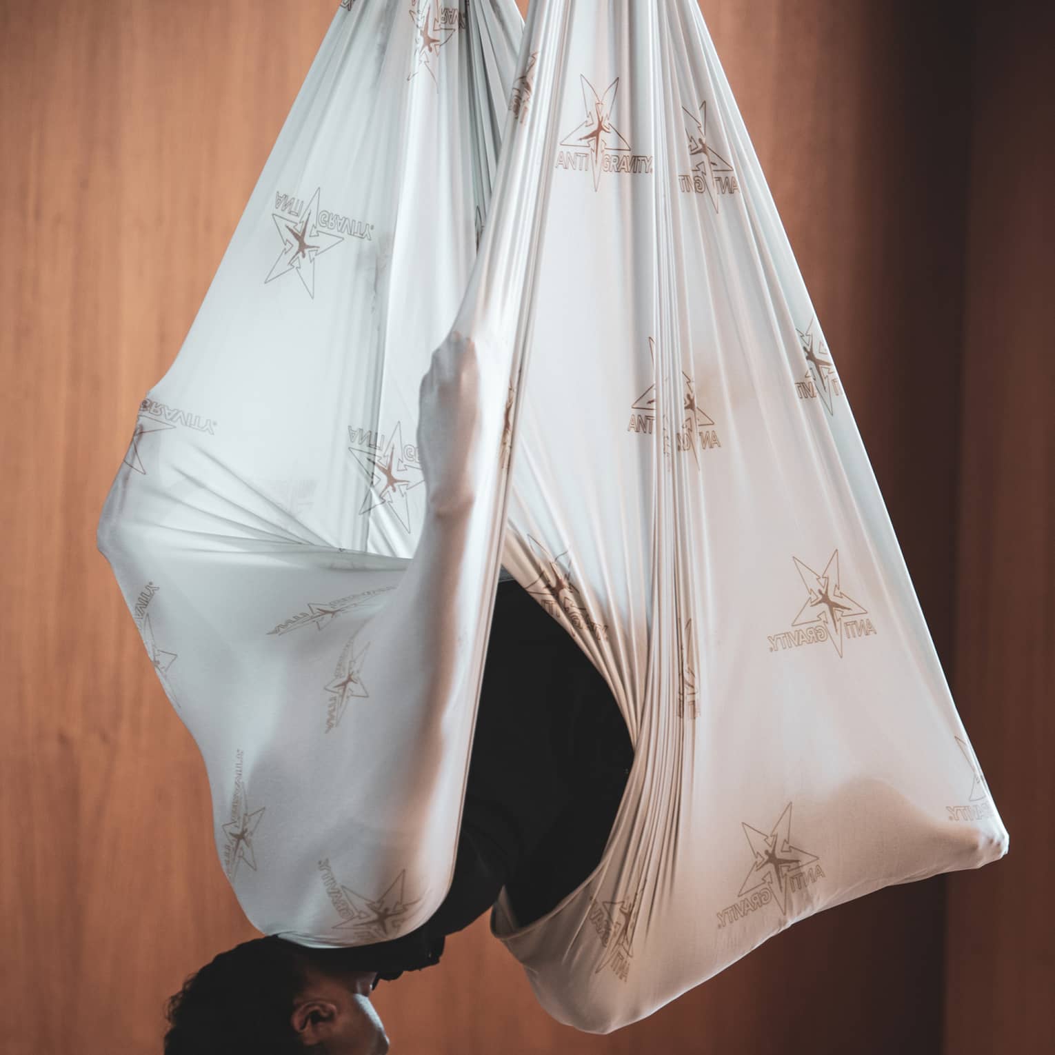 Man does aerial yoga