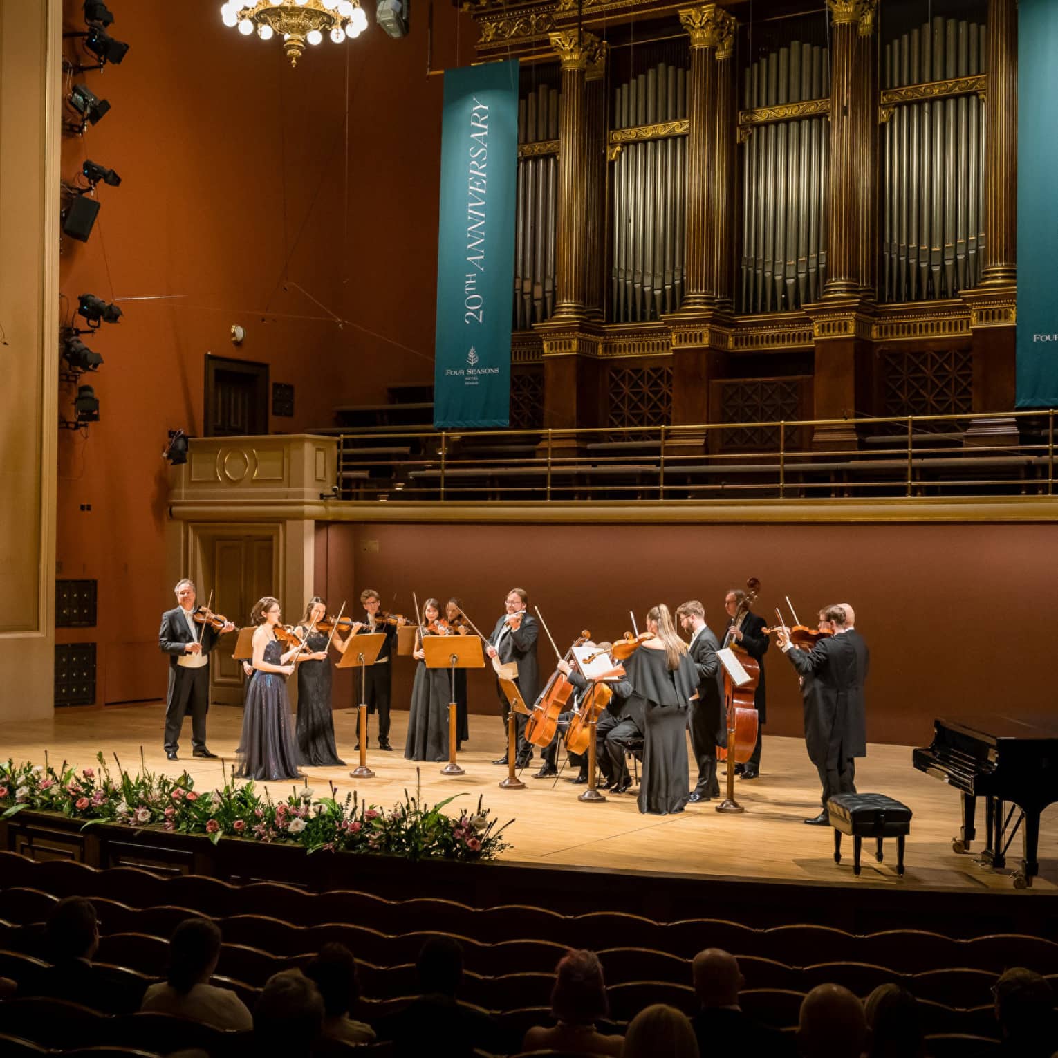 Musician ensemble standing on grand stage