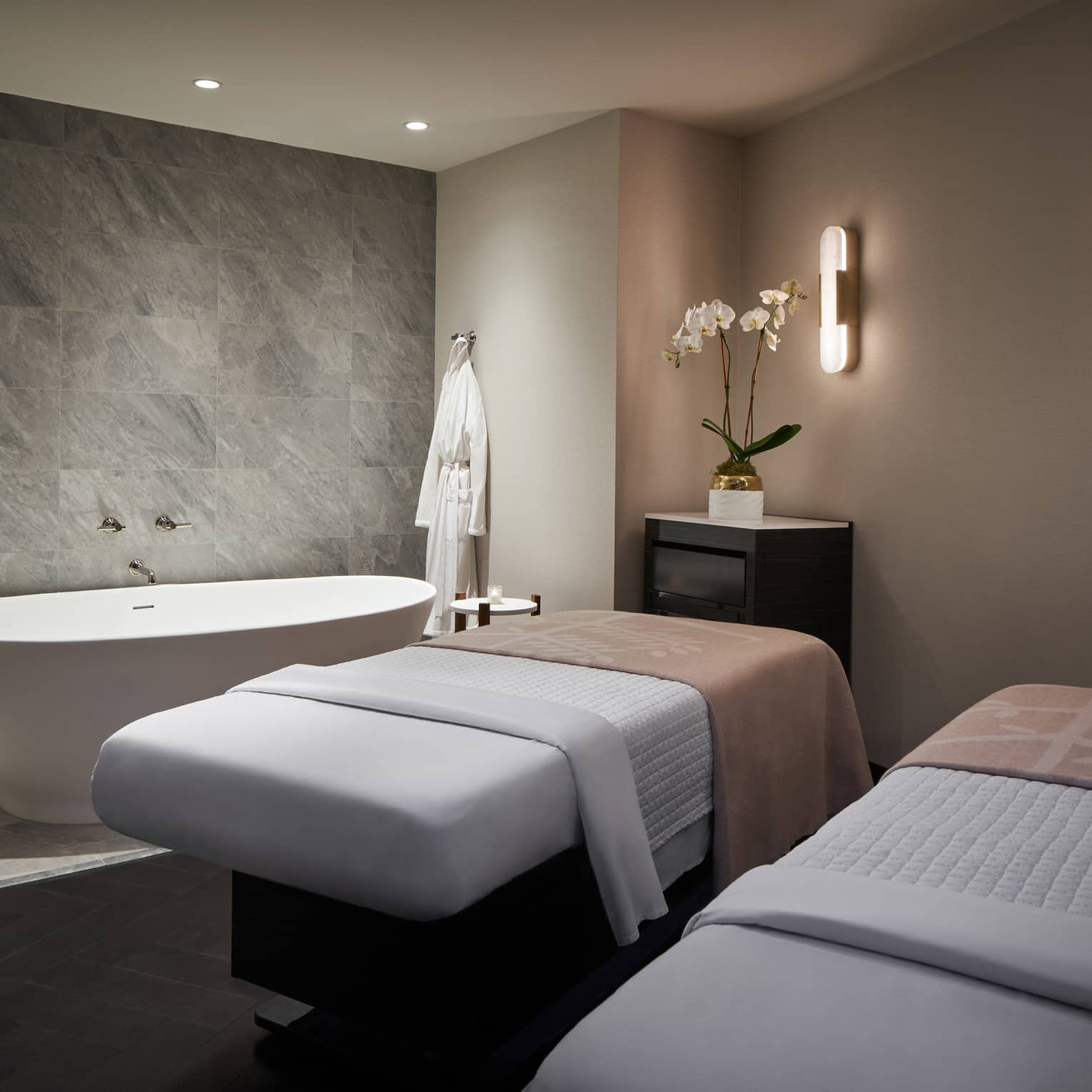 Spa room with massage tables and spa tub.