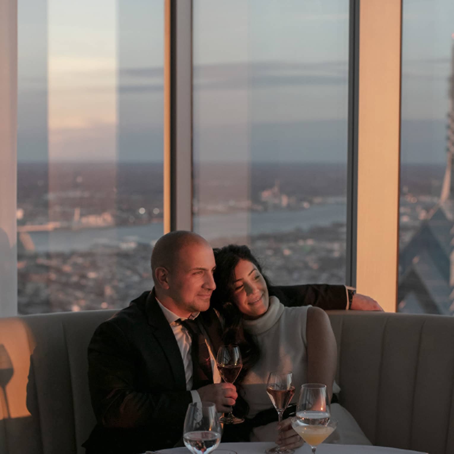 A man and woman drinking wine.