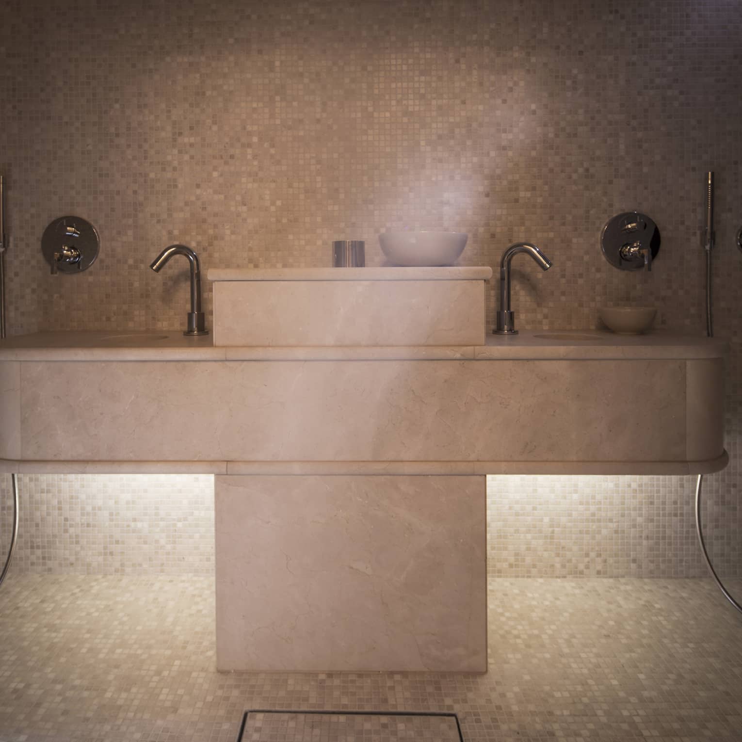 Spa steam room with double sink, tile floors, wall and ceiling