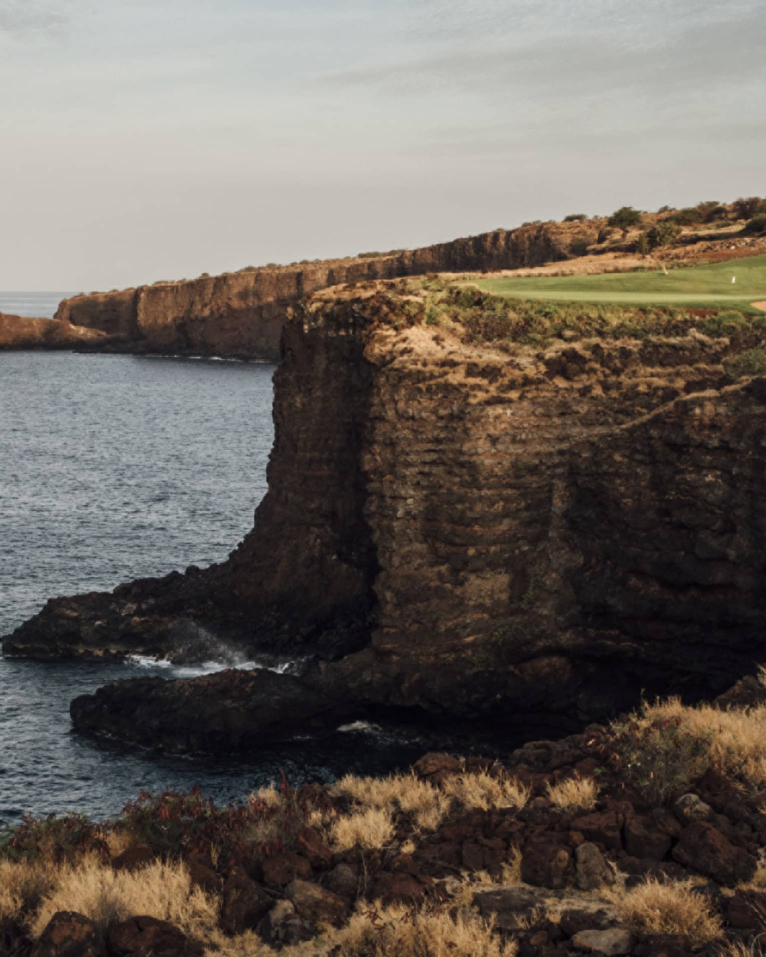 Golf course at Four Seasons Resort Lanai, cliffside along the ocean