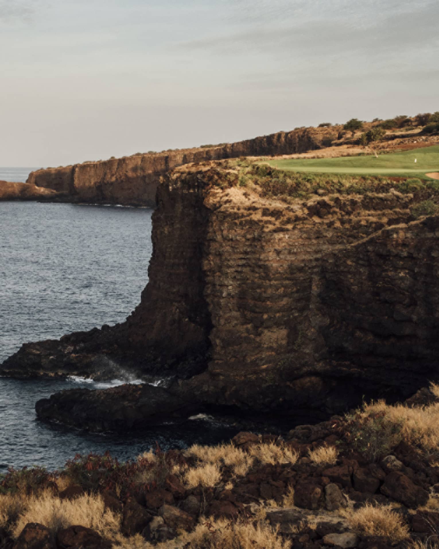 Golf course at Four Seasons Resort Lanai, cliffside along the ocean