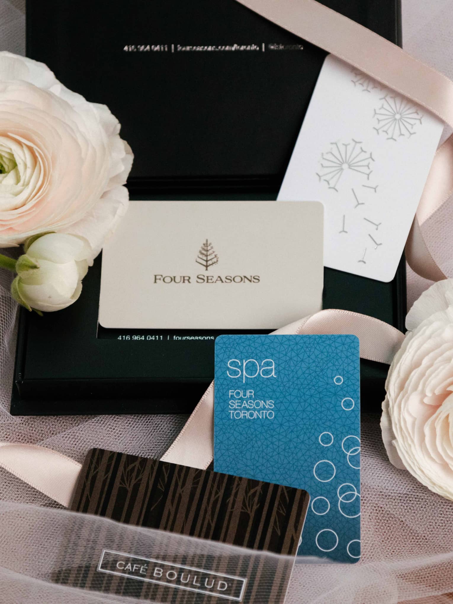 Arrangement of gift cards and flowers