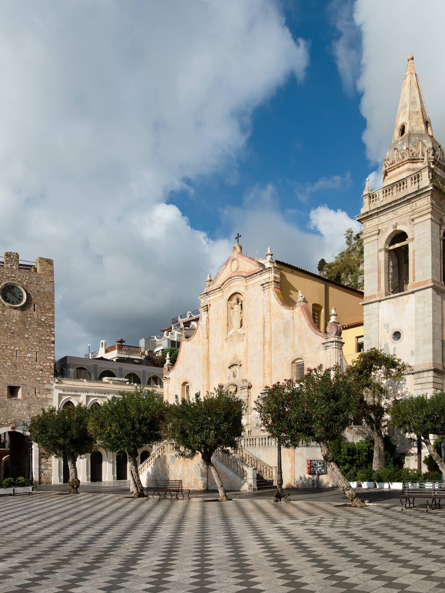 Piazza IX Aprile, photographed from a low angle on the tiled ground, in Taormina, Sicily