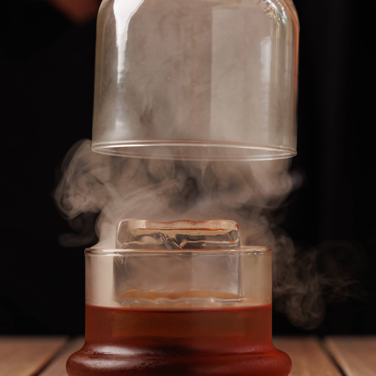 Smoky cocktail with glass case