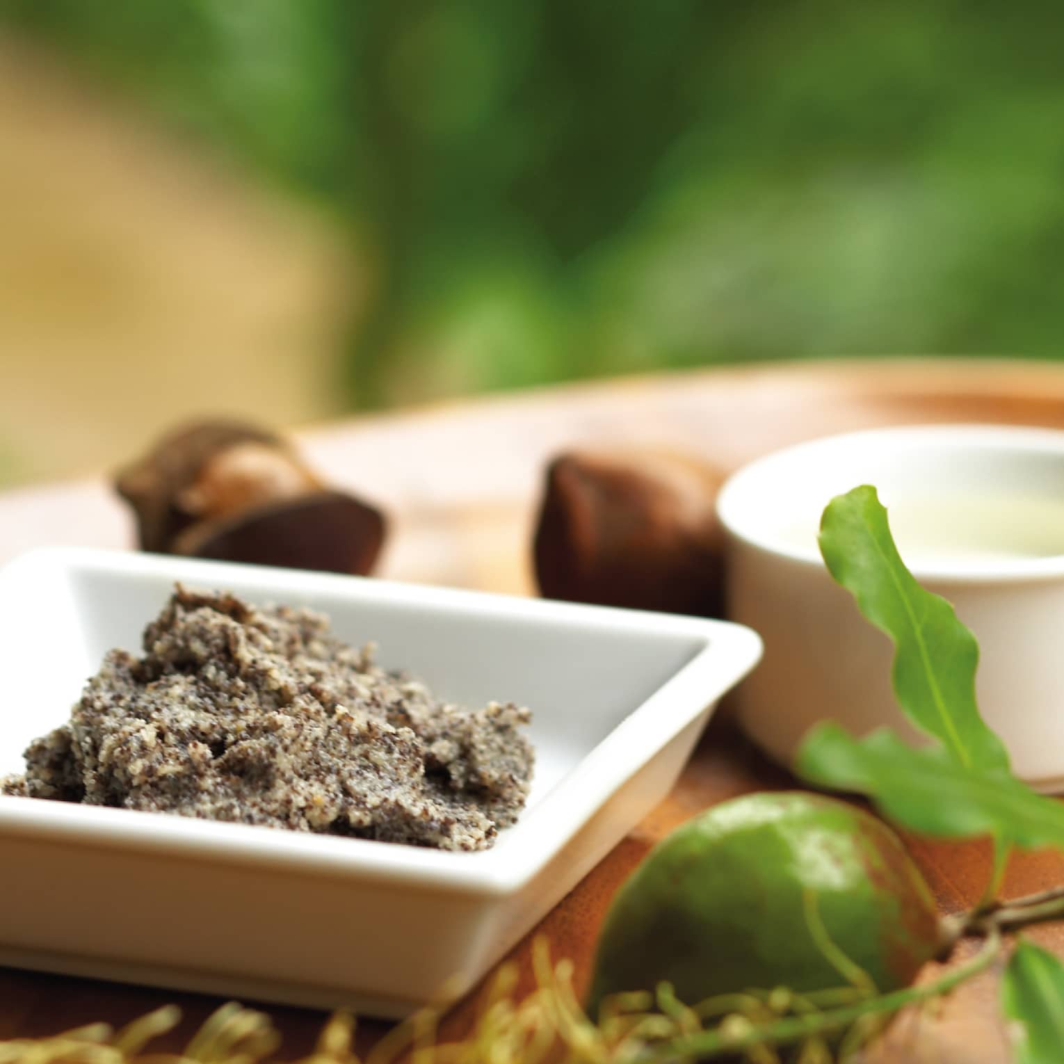 Ground nut butter, whole lime, small dishes on spa tray