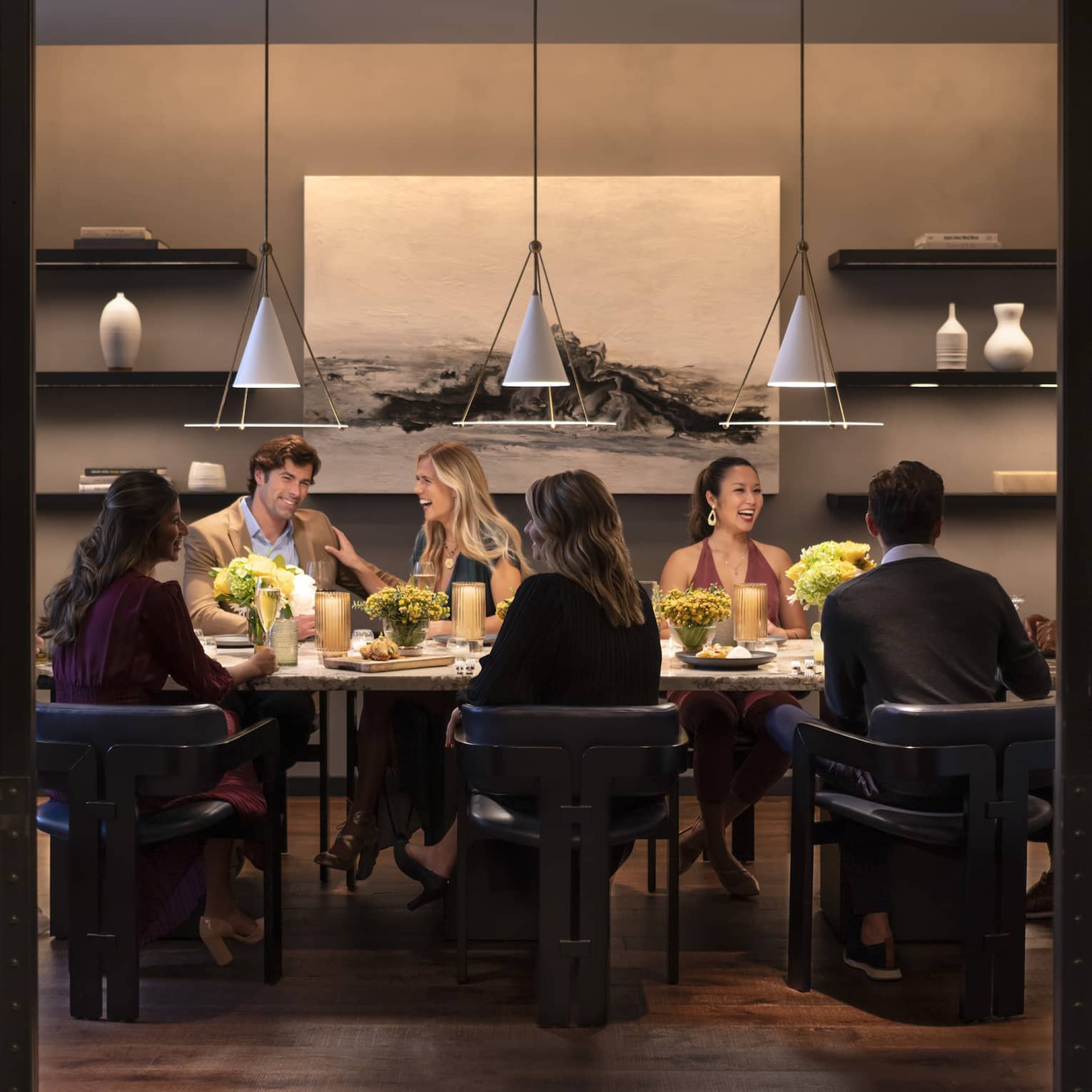 Interior of restaurant with group eating at table