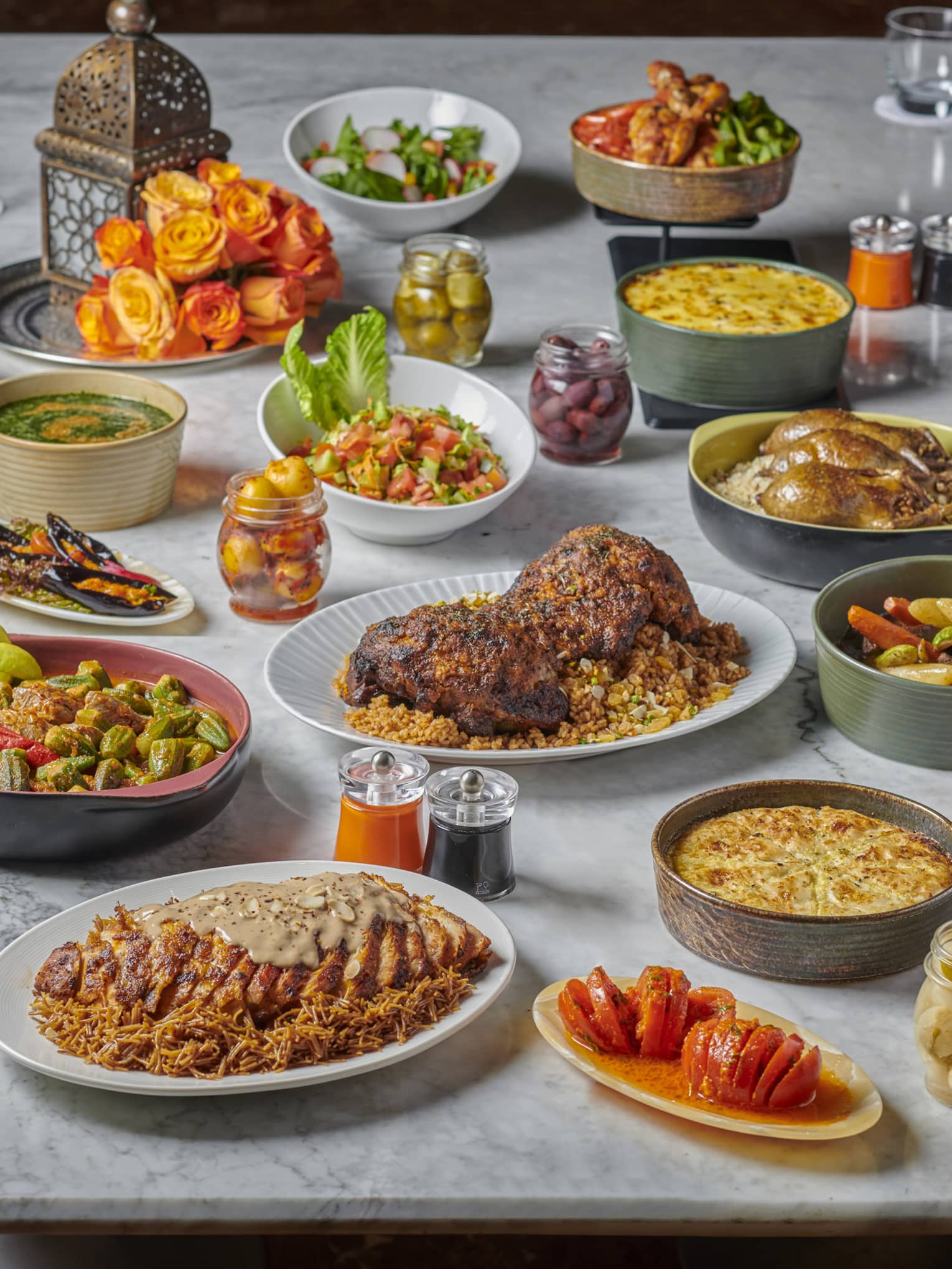A full set of appetisers on a grey marble countertop.