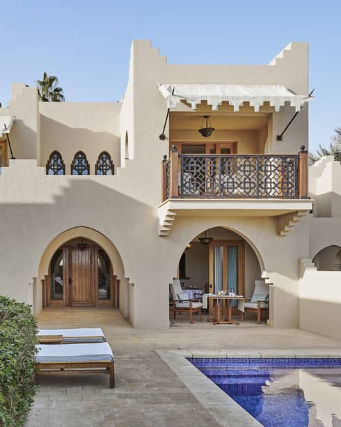 Villa with traditional Egyptian detailing, and pool with sun loungers