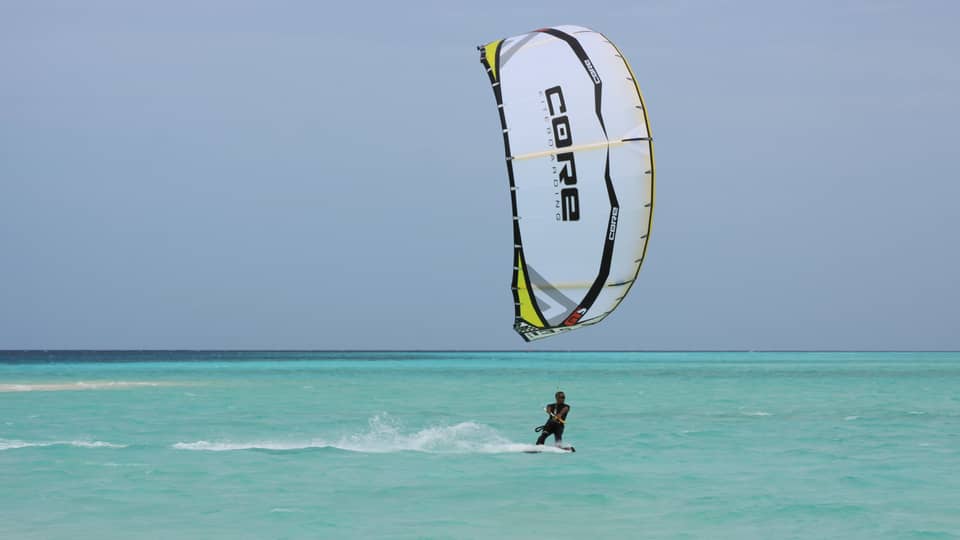 Windsurfer on blue ocean